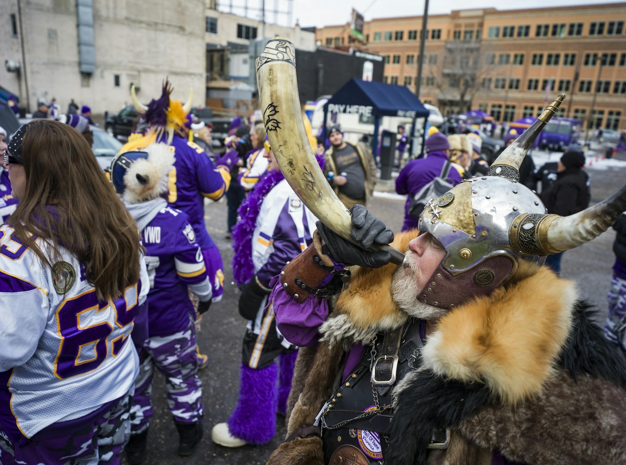 Greg Hanson blows his horn as part of his persona as the Norse god Odin. He likes to be known as "
Sir Odin. "] Story about tailgating and how it has changed. RICHARD TSONG-TAATARII ¥ richard.tsong-taatarii@startribune.com