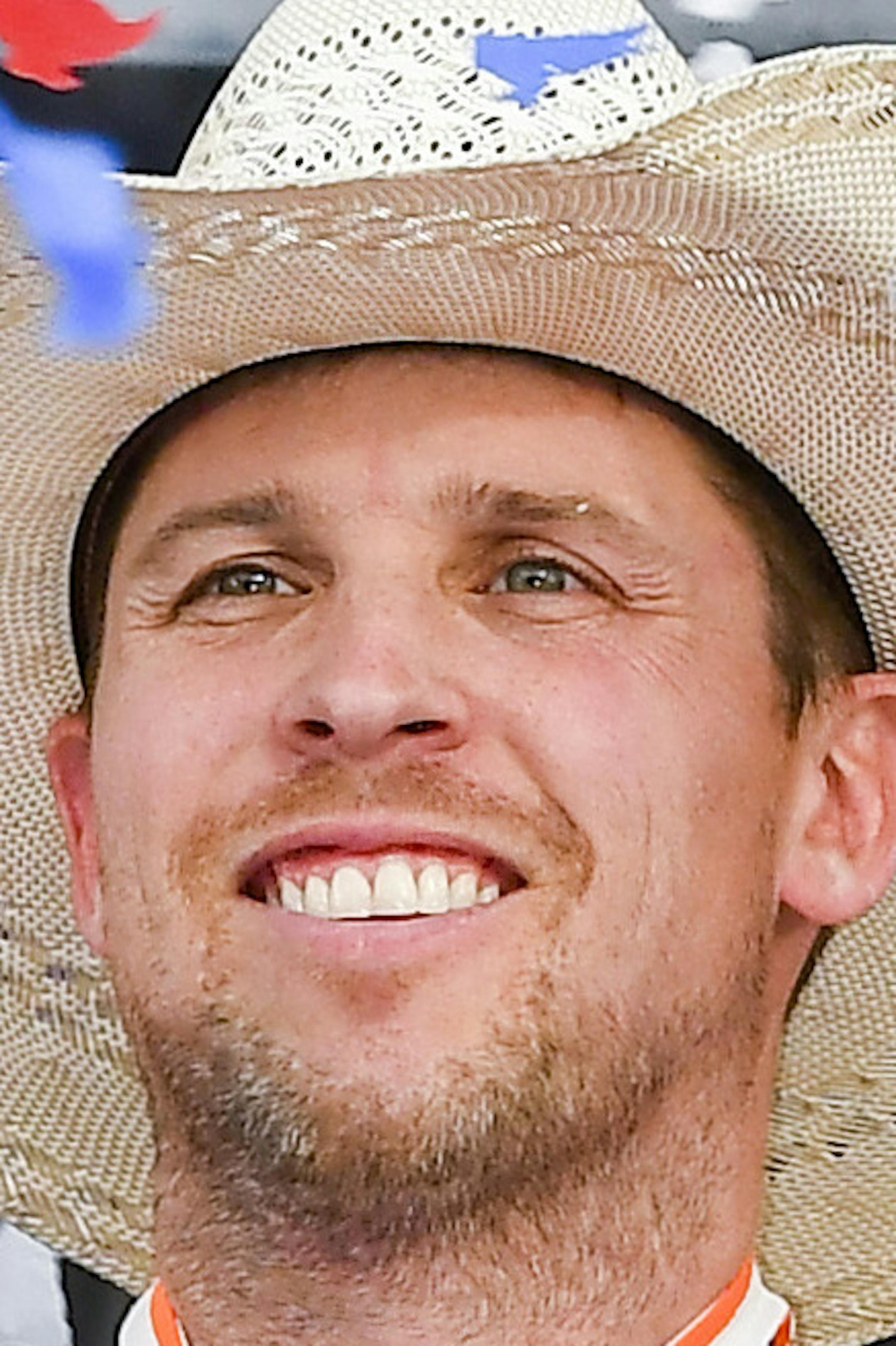 Drive Denny Hamlin celebrates in victory lane after winning a NASCAR Cup auto race at Texas Motor Speedway, Sunday, March 31, 2019, in Fort Worth, Texas. (AP Photo/Larry Papke)