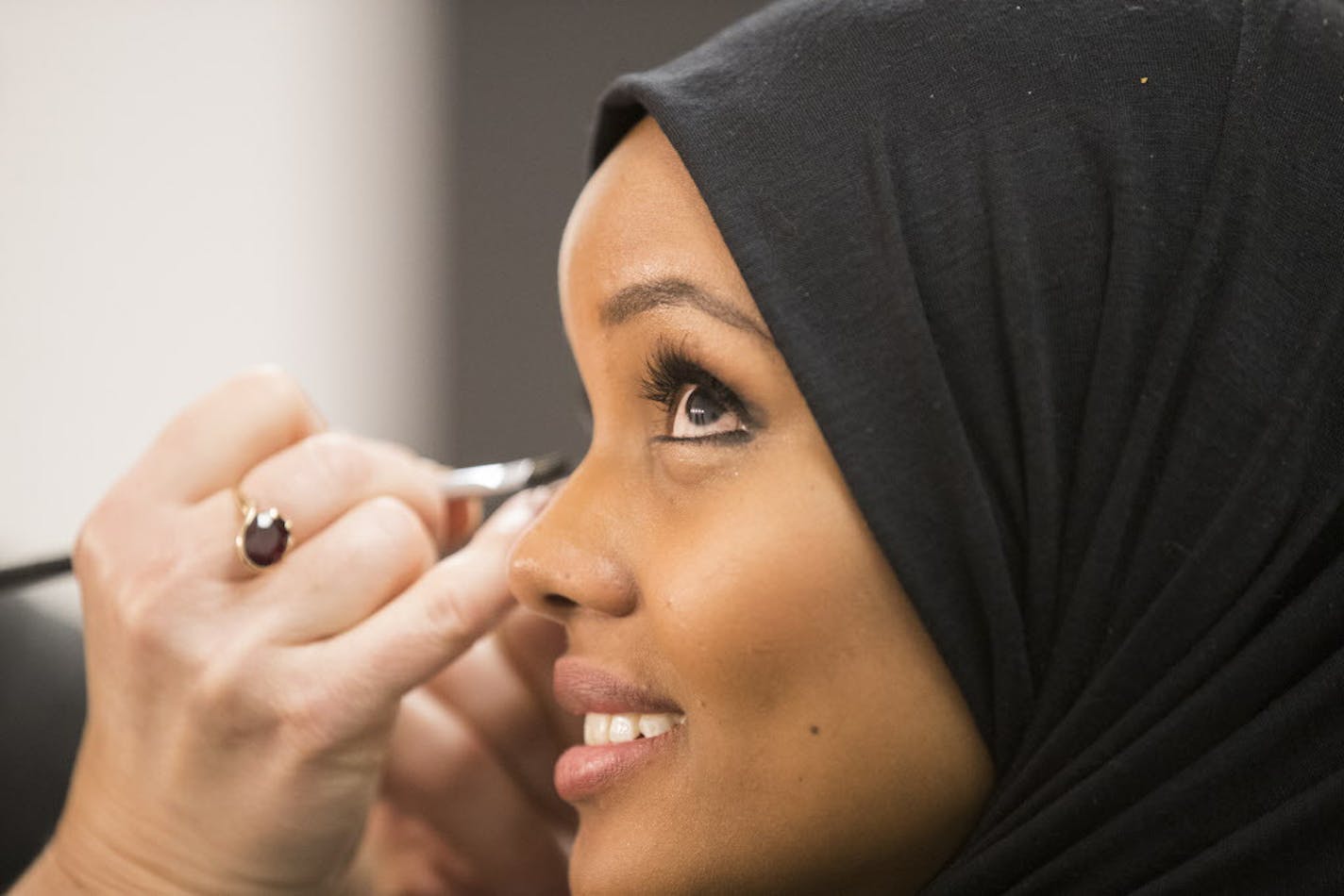 Halima Aden has her makeup done for the Miss Minnesota USA pageant. ] (Leila Navidi/Star Tribune) leila.navidi@startribune.com BACKGROUND INFORMATION: Halima Aden competes in the preliminary round of the Miss Minnesota USA pageant at the Ames Center in Burnsville on Saturday, November 27, 2016. Somali-American Halima Aden, 19, will become the first woman to compete for the title of Miss Minnesota USA while wearing a burkini, which she hopes will break barriers for other young Muslim women.