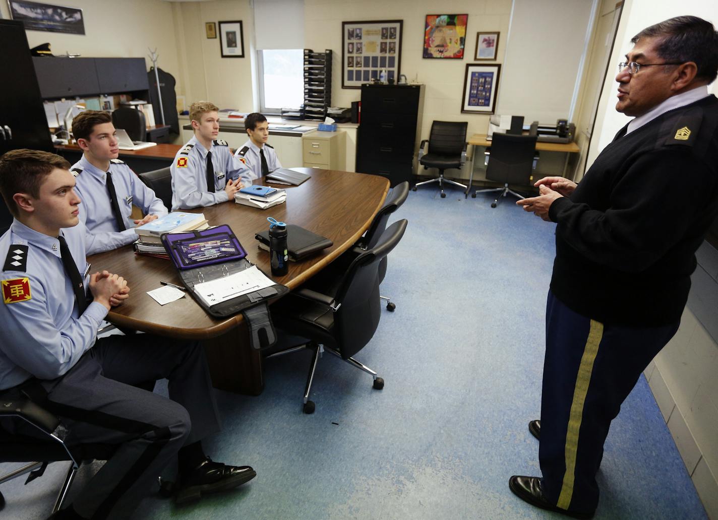 1st Sgt. Fernando Hernandez (right) teaches Advanced Leadership during a morning class. (LtoR) Connor Duffy, Andrew Mayleben, Michael Miller and Joshua Tarum. ] For 99 years, a cornerstone of prestigious St. Thomas Academy, Minnesota&#x2019;s only military academy, has been its affiliation with JROTC, the Army&#x2019;s Junior Reserve Officer Training Corps. Every student at the Catholic, all-boys school must be a JROTC member. The school&#x2019;s uniforms, JROTC instructors and military curricul