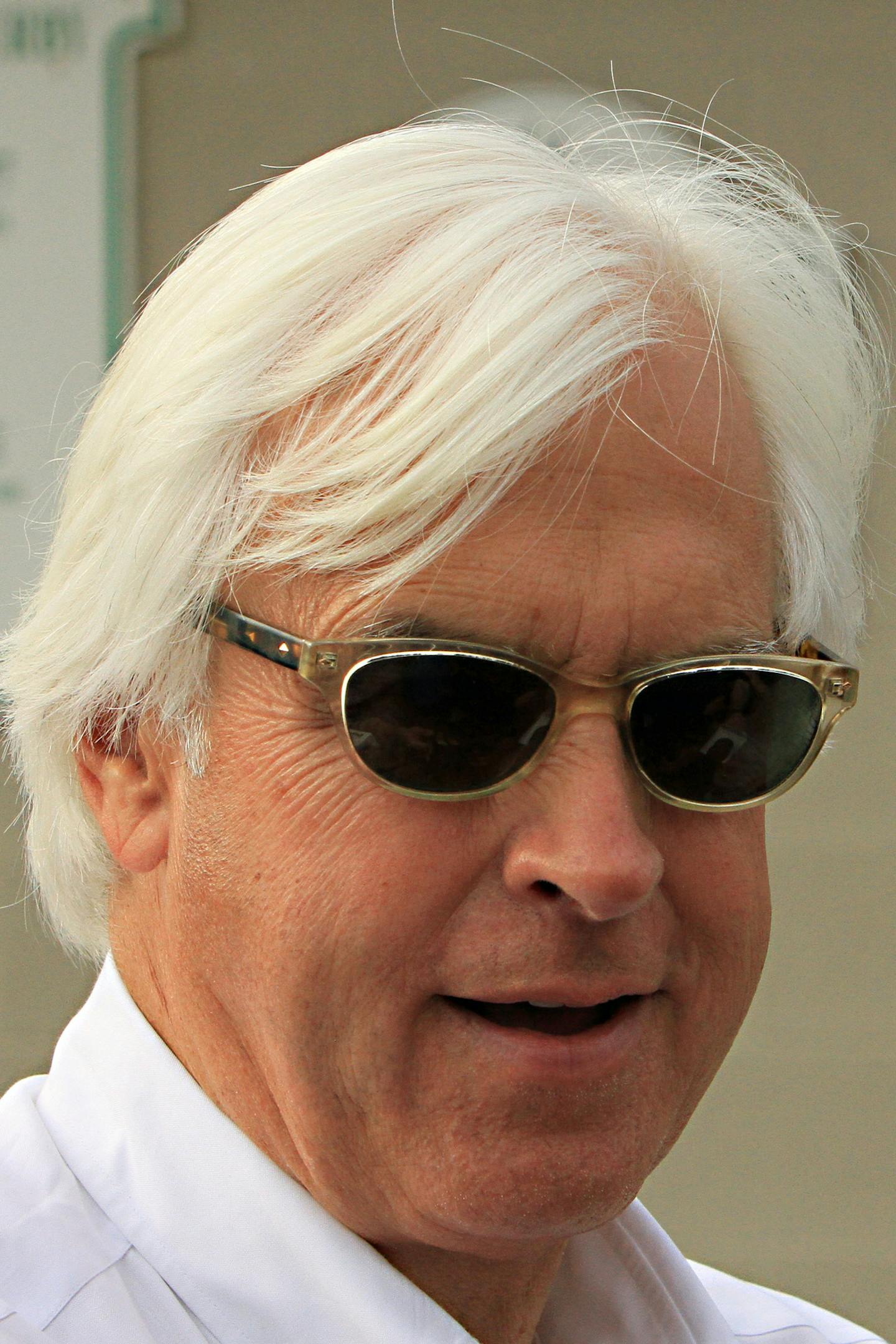 Hall of Fame trainer Bob Baffert talks to the media outside Barn 33 at Churchill Downs in Louisville, Ky., Monday, May 11, 2015 after his two Preakness Stakes-bound colts, American Pharoah and Dortmund, galloped. (AP Photo/Garry Jones)