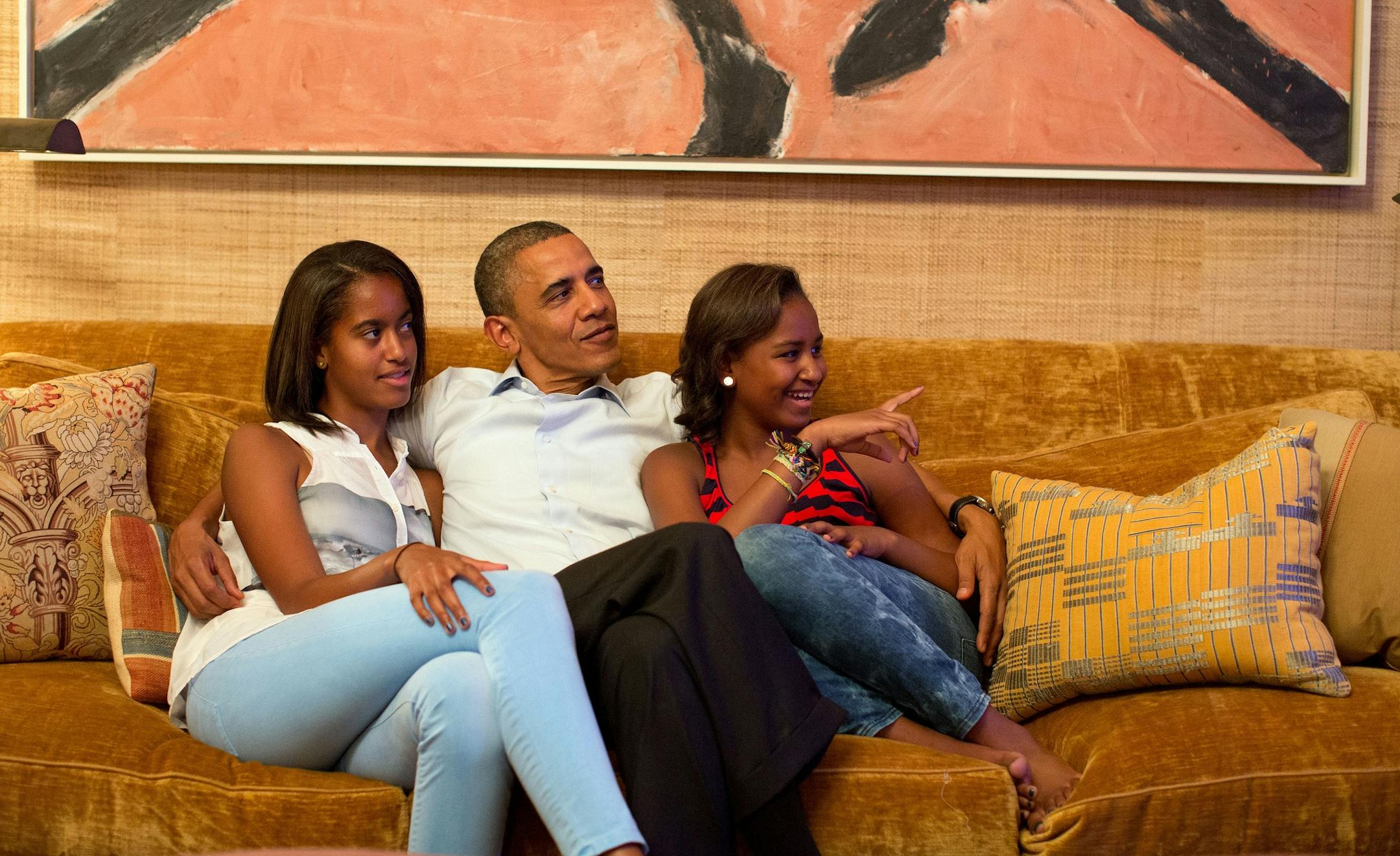 President Barack Obama and his daughters, Malia, left, and Sasha, watch on television as First Lady Michelle Obama takes the stage to deliver her speech at the Democratic National Convention, in the Treaty Room of the White House, Tuesday night, September 4, 2012 in Washington, D.C.