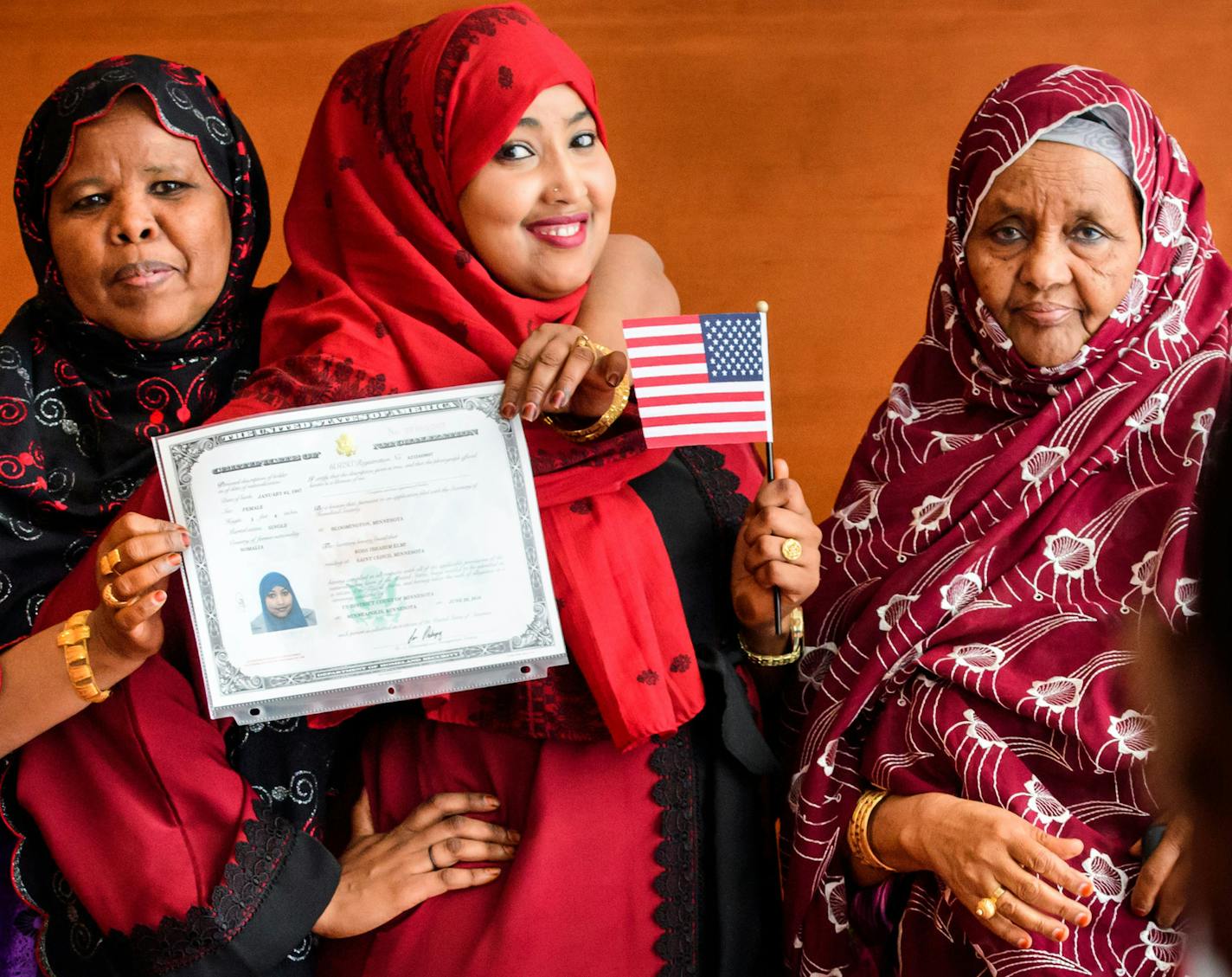 Koss Elmi, center, posed with her mom Bilad Ibrahim, left, and Aunt Habiba Farah after she became a U.S. citizen.