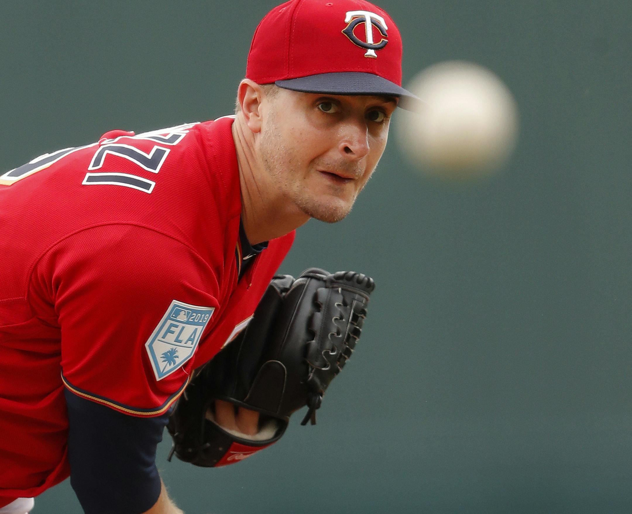 Minnesota Twins starting pitcher Jake Odorizzi (12) works against the Tampa Bay Rays in the first inning of a spring training baseball game Tuesday, March 5, 2019, in Fort Myers, Fla. (AP Photo/John Bazemore)