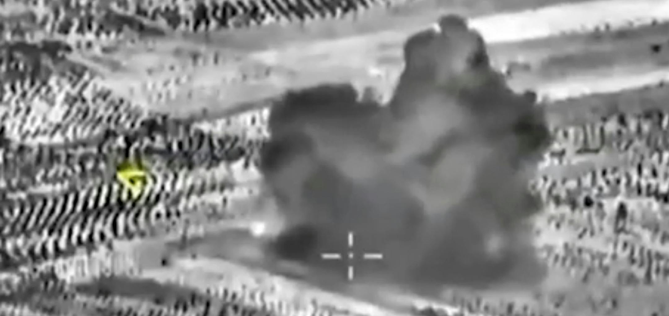 This image made from footage taken from Russian Defense Ministry official website on Friday, Oct. 2, 2015, shows another attack made from a fighter jet in Syria. The Russian Defense Ministry says its aircraft have carried out 18 sorties in Syria in the past 24 hours, including 10 overnight in which seven sites were bombed. The annotations on the image were made by the source and indicate the center of the target, and its direction, yellow. (AP Photo/ Russian Defense Ministry Press Service)