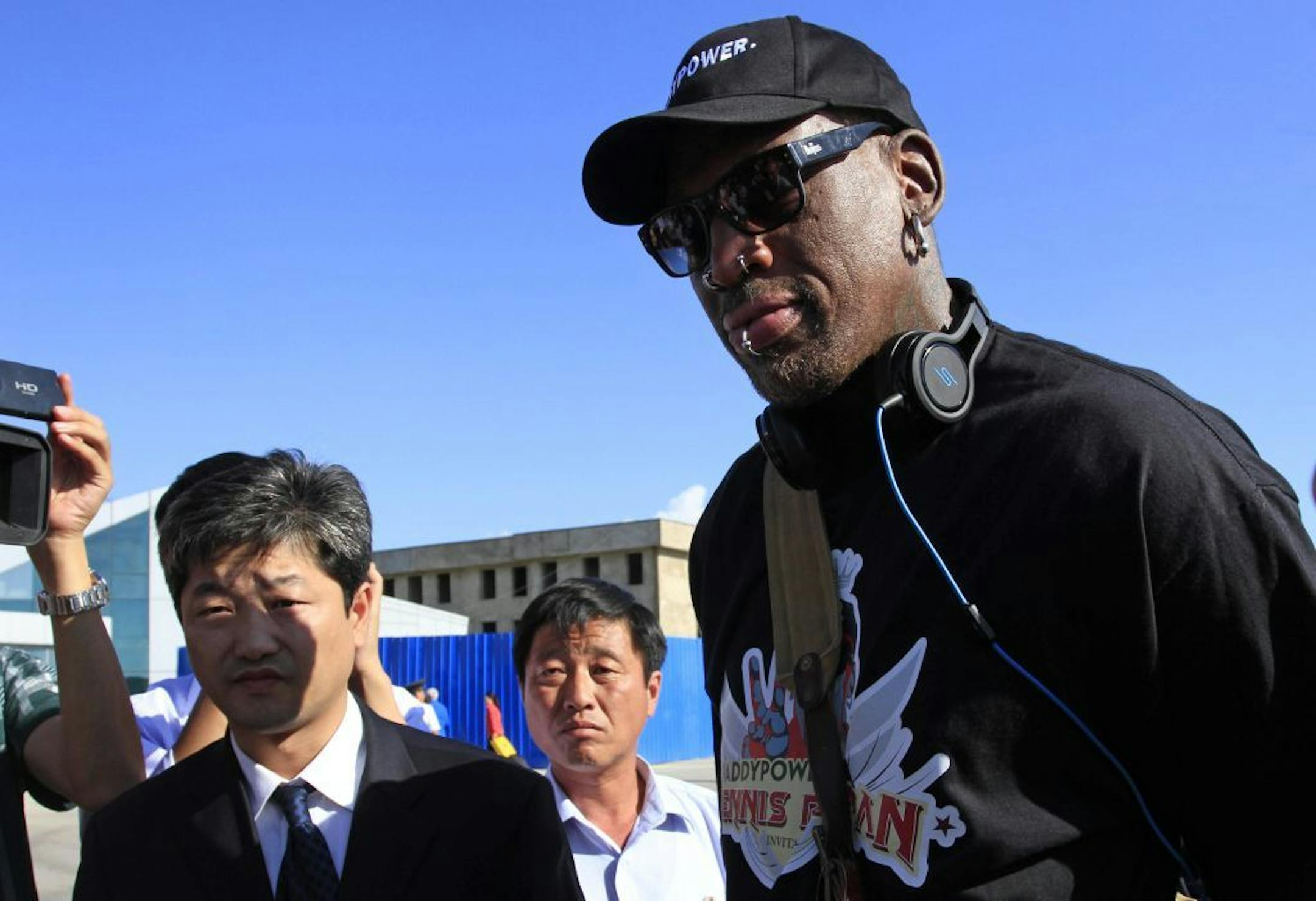 Former NBA star Dennis Rodman arrives at Pyongyang airport, North Korea, Tuesday, Sept. 3, 2013.