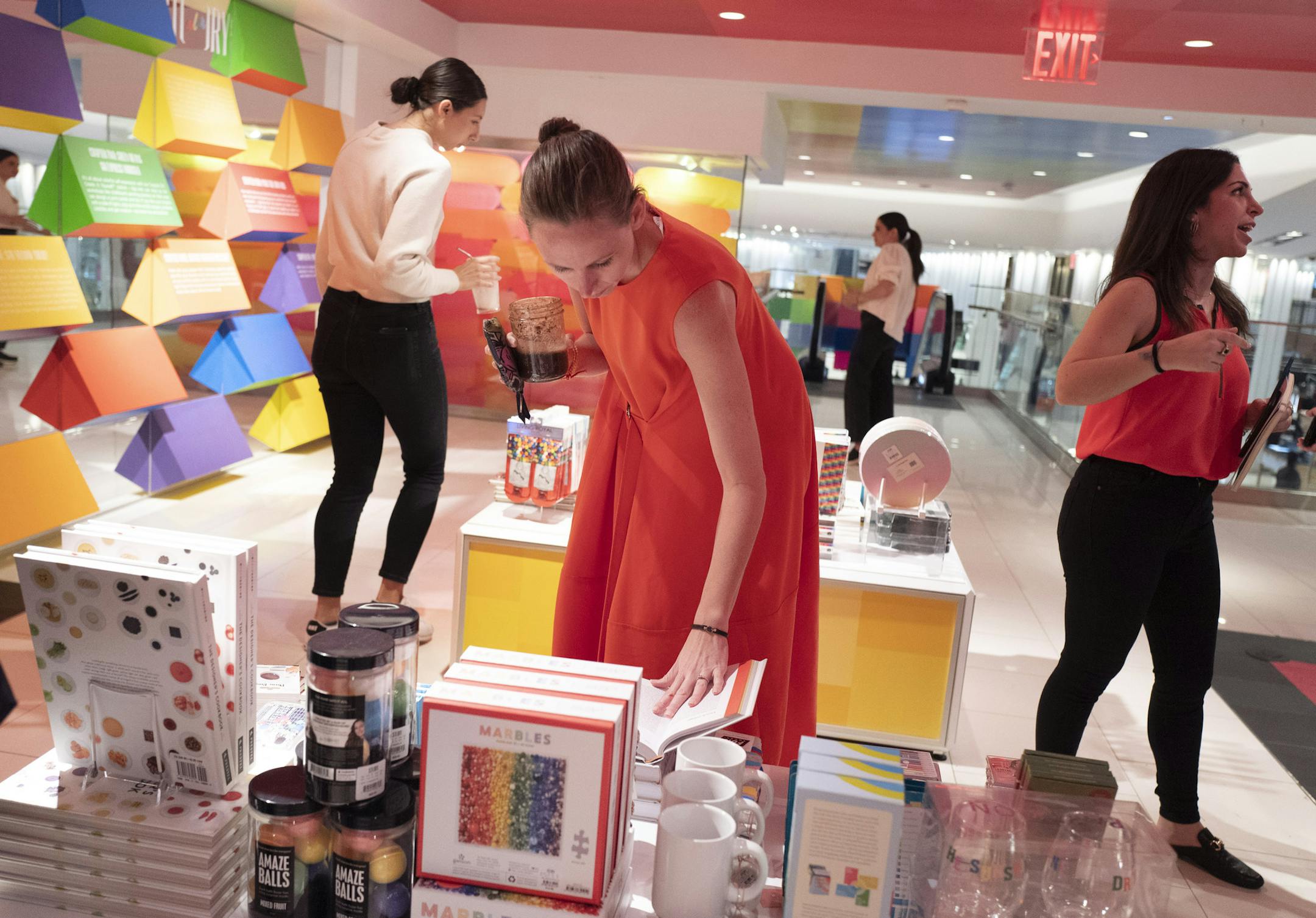 People browse at the opening day of Story, Wednesday, April 10, 2019, at Macy's in New York. Industry watchers are closely watching Macy's partnership with Story. (AP Photo/Mark Lennihan) ORG XMIT: NYML109