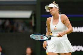 Marketa Vondrousova of the Czech Republic reacts during her first round match against Jessica Bouzas Maneiro of Spain at the Wimbledon tennis champion