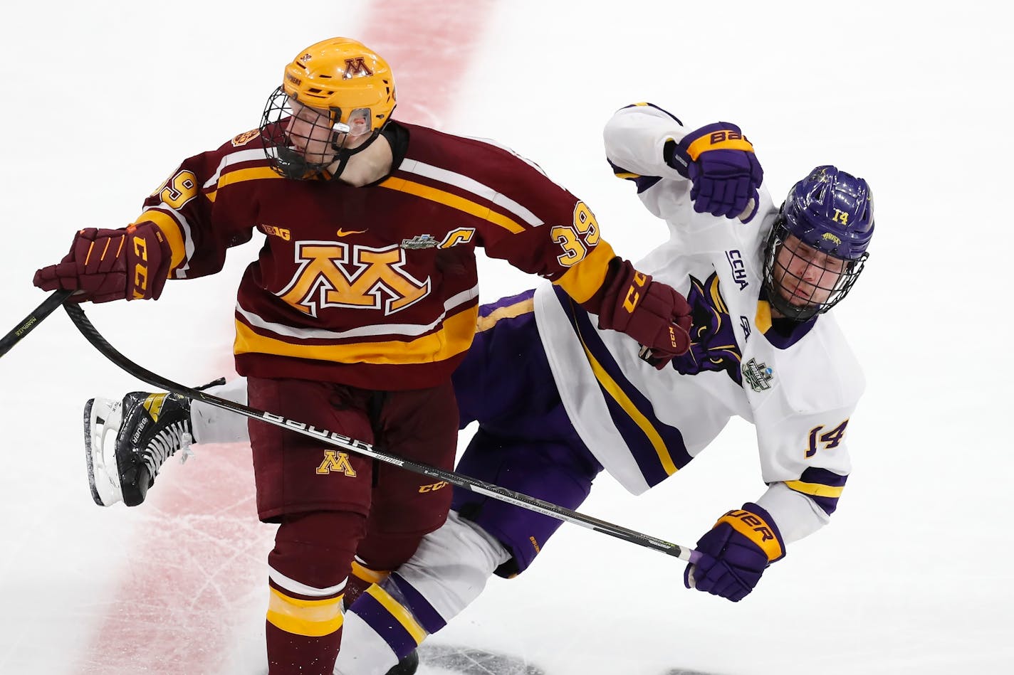 Minnesota's Ben Meyers (39) checks Minnesota State's Ryan Sandelin (14) during the second period of an NCAA men's Frozen Four semifinal hockey game, Thursday, April 7, 2022, in Boston. (AP Photo/Michael Dwyer)