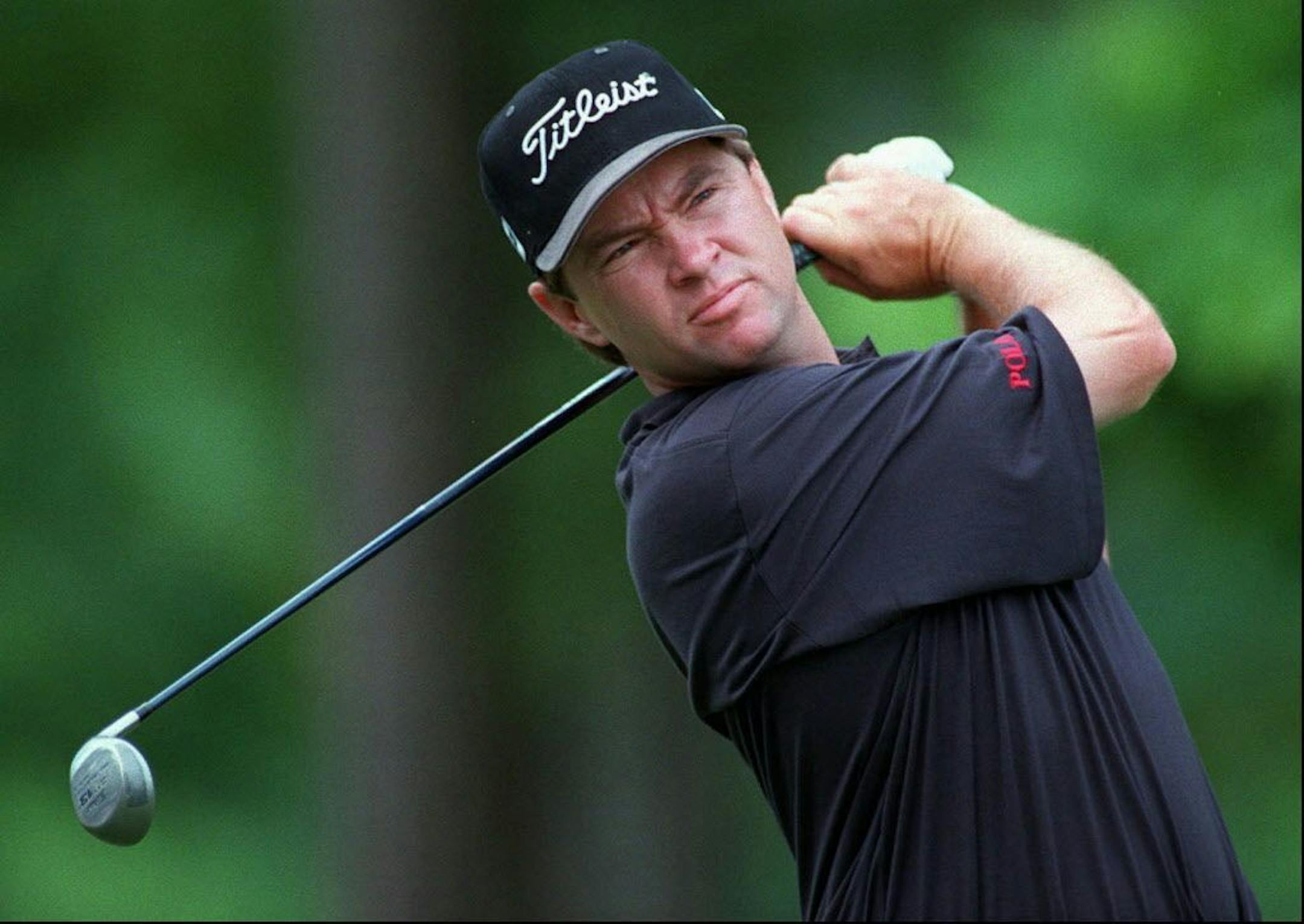Davis Love III tees off on the eleventh hole Tuesday, April 22, 1997 during the Andersen Consulting Championship match play against Tom Lehman in Lake Oconee, Ga.