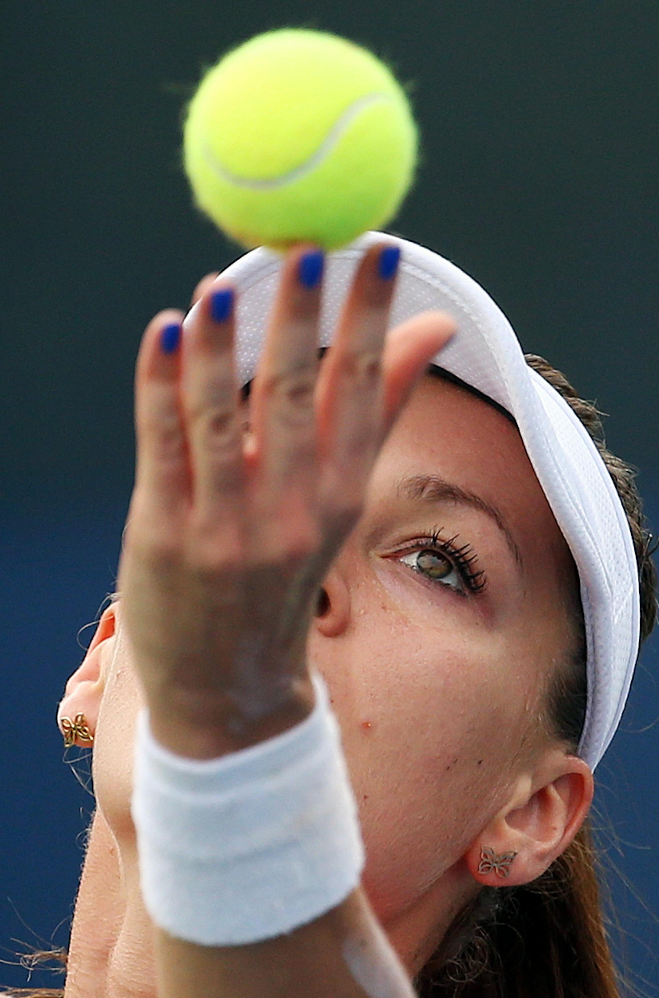 Agnieszka Radwanska, of Poland, serves to Katerina Siniakova, of the Czech Republic, during the first round of the U.S. Open tennis tournament, Monday, Aug. 31, 2015, in New York. (AP Photo/Adam Hunger)