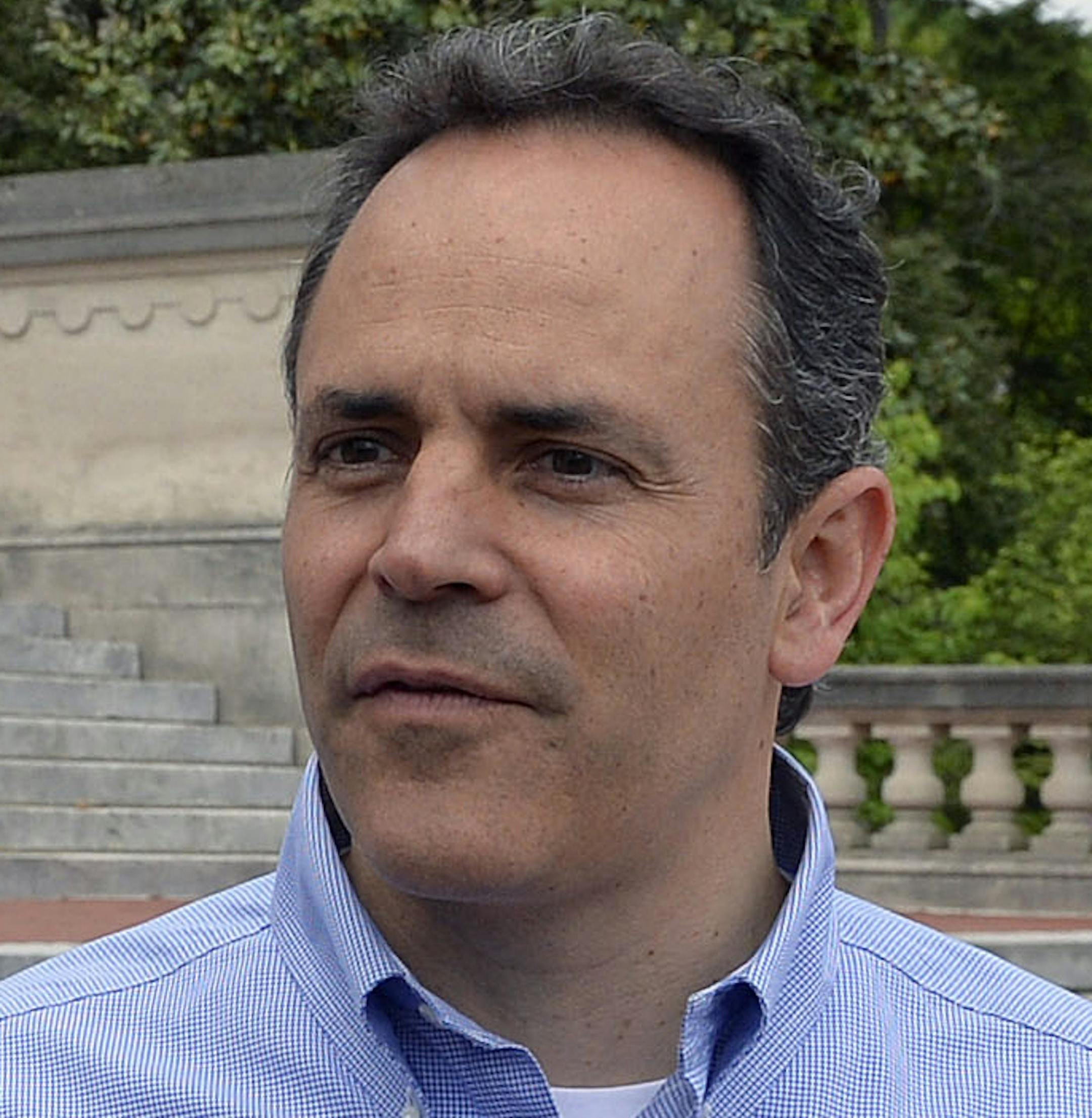 Kentucky Republican senatorial candidate Matt Bevin speaks with reporters Friday May 16, 2014, on the steps of the Kentucky State Capitol in Frankfort, Ky. Bevin is touring the state on a last push before the primary on May 20th. (AP Photo/Timothy D. Easley)
