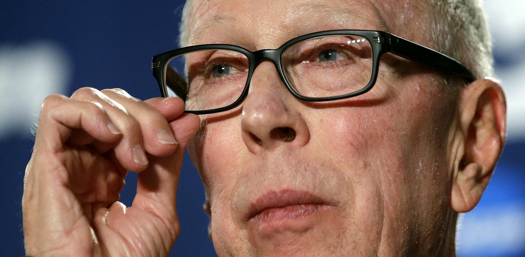 San Diego State head coach Steve Fisher adjusts his eyeglasses as he listens to a question at a news conference before the third round of the NCAA men's college basketball tournament in Spokane, Wash., Friday, March 21, 2014. San Diego State plays North Dakota State on Saturday. (AP Photo/Elaine Thompson)
