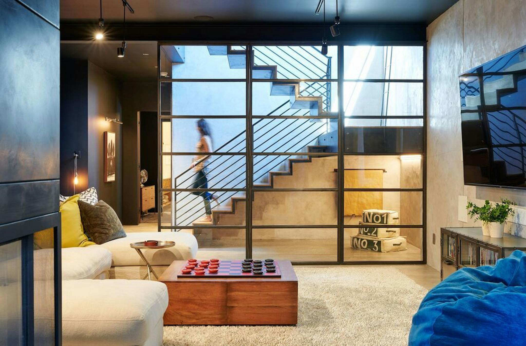 The floating staircase to the walkout lower level.
