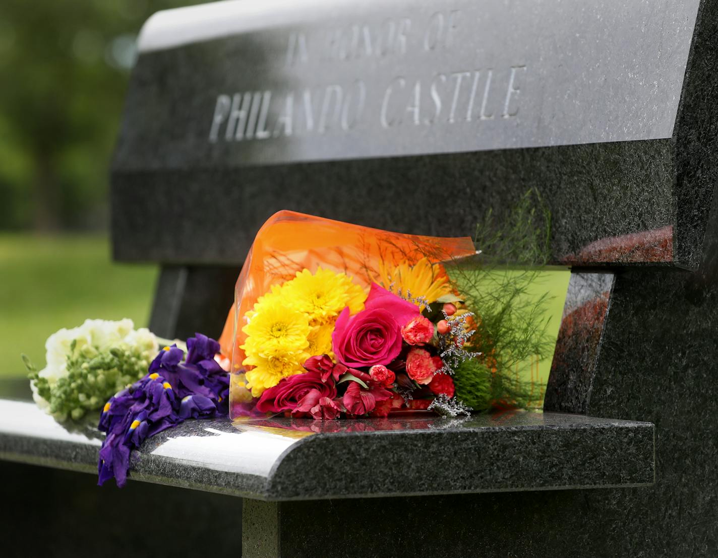 Flowers rest on a Memorial bench to Philando Castile, outside J.J. Hill Montessori Magnet School, where Castile worked as a nutrition services supervisor and was seen Saturday, June 17, 2017. Castile was fatally shot by St. Anthony officer Jeronimo Yanez during a traffic stop on July 6. Yanez was acquitted of all charges in a verdict at the Ramsey County Courthouse Friday.] DAVID JOLES &#xef; david.joles@startribune.com Yanez aftermath