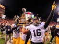 It was still a 2015 Hawkeyes season to remember, though. Quarterback C.J. Beathard (16) and his teammates celebrated a victory at Nebraska to complete