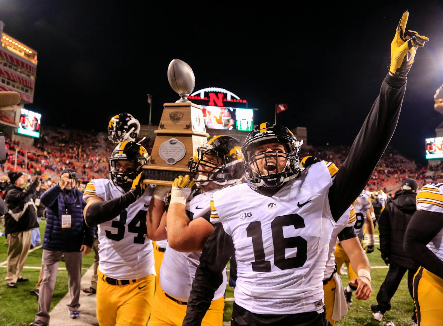 It was still a 2015 Hawkeyes season to remember, though. Quarterback C.J. Beathard (16) and his teammates celebrated a victory at Nebraska to complete a 12-0 run.