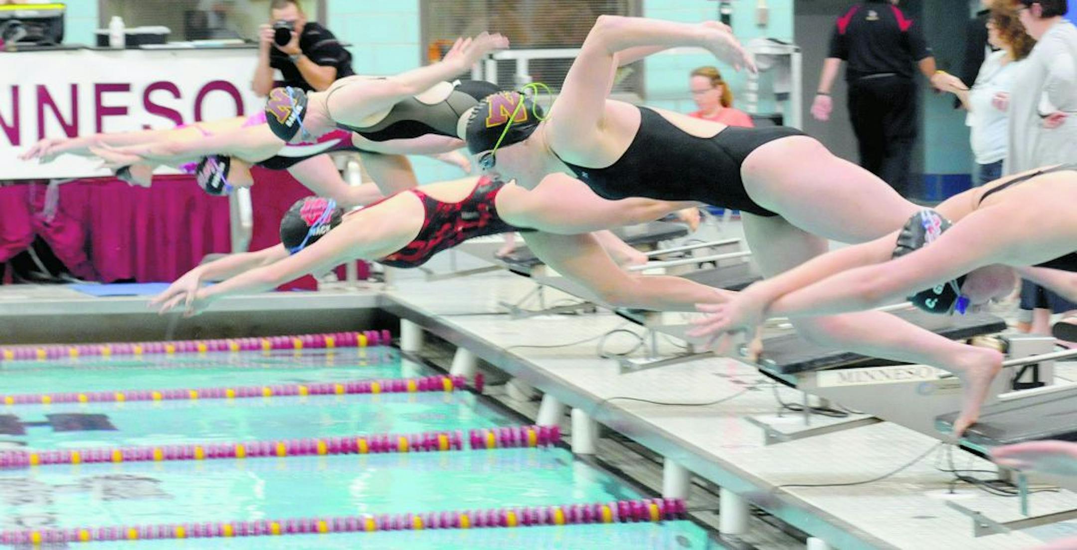 Claire Walters, second from right, and Grete Baker, fourth from right, competed for Northfield on Oct. 20 in the 100-yard butterfly in the True Team state meet at the University of Minnesota Aquatic Center. The Gators finished second, and will be one of the teams to beat in the Class 1A state meet on Nov. 17. Photo by JORDAN OSTERMAN • Northfield News