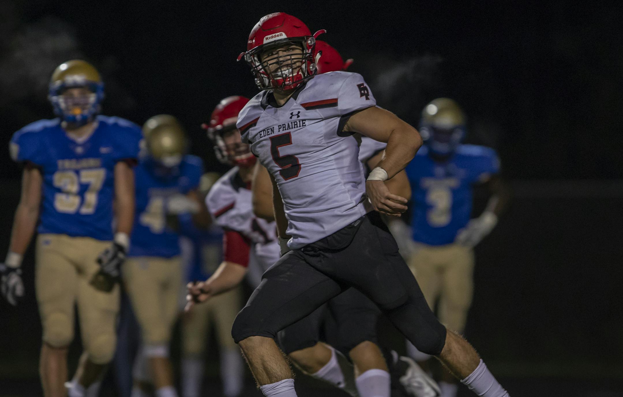 Wayzata defensive back Jacob Beeninga (5) silences the Wayzata Trojans crowd after scoring late in the fourth quarter to put the Eagles up by a touchdown. ] Special to Star Tribune, photo by Matt Blewett, Matte B Photography, matt@mattebphoto.com, Wayzata High School, Wayzata, Minnesota, Wayzata Trojans, Eden Prairie Eagles, Football, Sept. 21, 2018, Minnesota, SAXO 1006864901 PREP092218.way