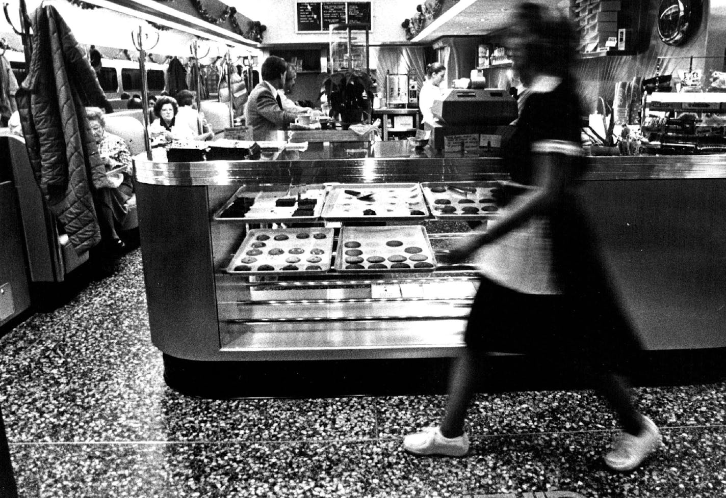 December 8, 1982 Customers at the Ediner encounter a showcase with brownies and cookies.