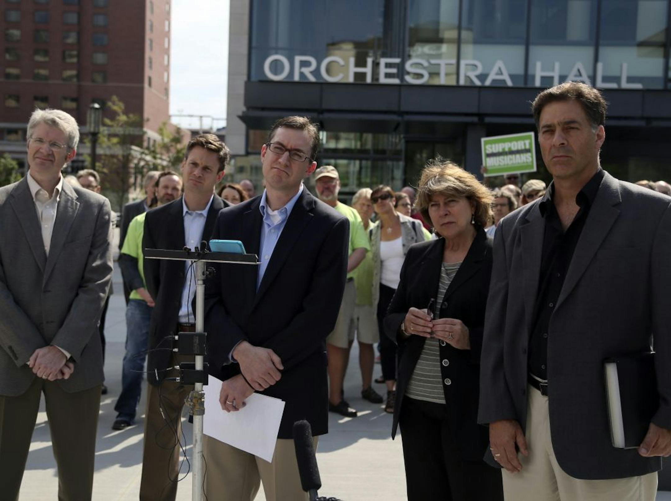 Locked-out Minnesota Orchestra musicians gathered outside Orchestra Hall Thursday to report they unanimously rejected a formal offer by management to resolve a labor dispute. Seen from left are all five members of the musicans' negotiating committee: Doug Wright, Kevin Watkins, Tim Zavadil, Marcia Peck and Tony Ross.