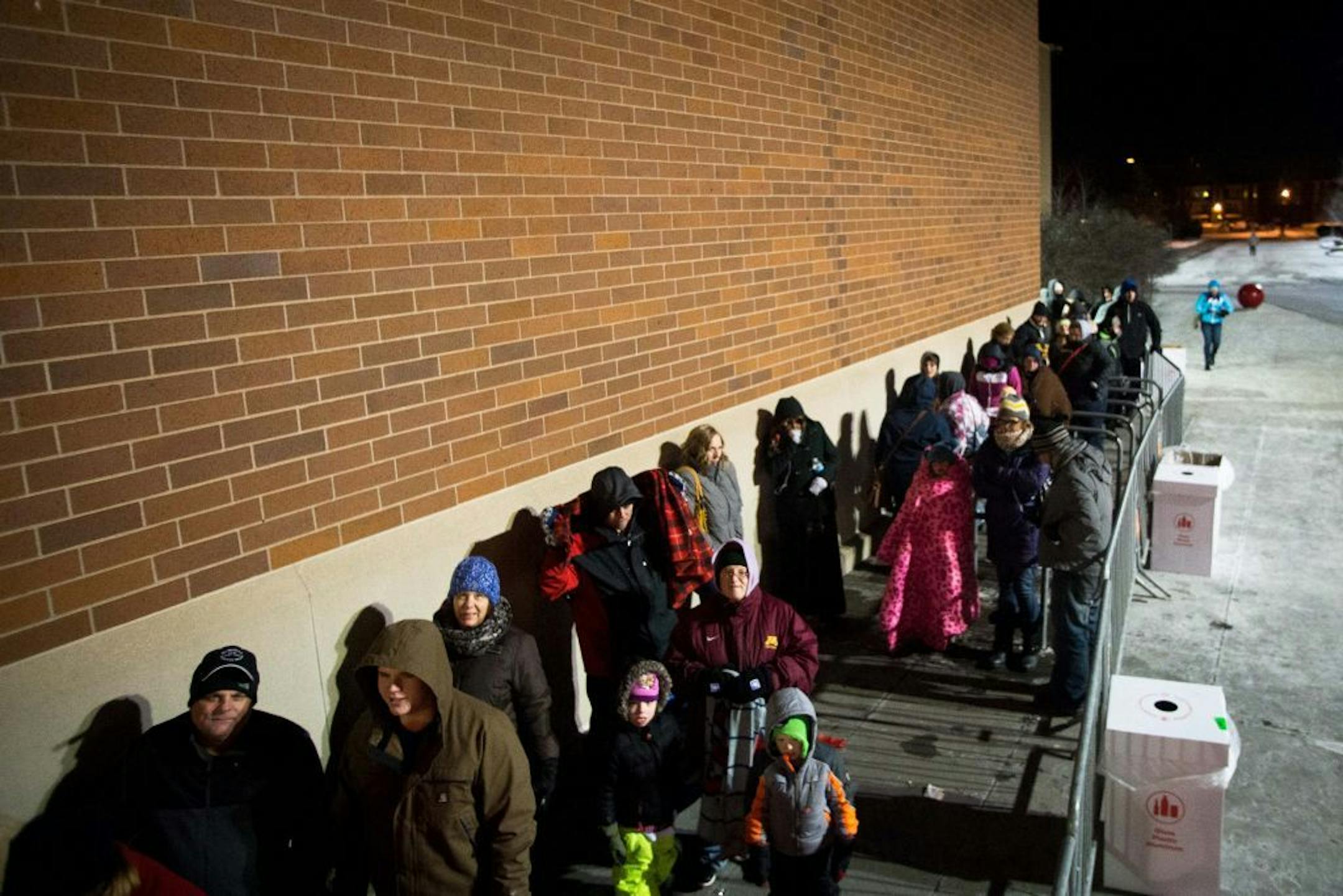Dozens of shoppers line up outside the Super Target in Roseville to get early deals on Thanksgiving night.