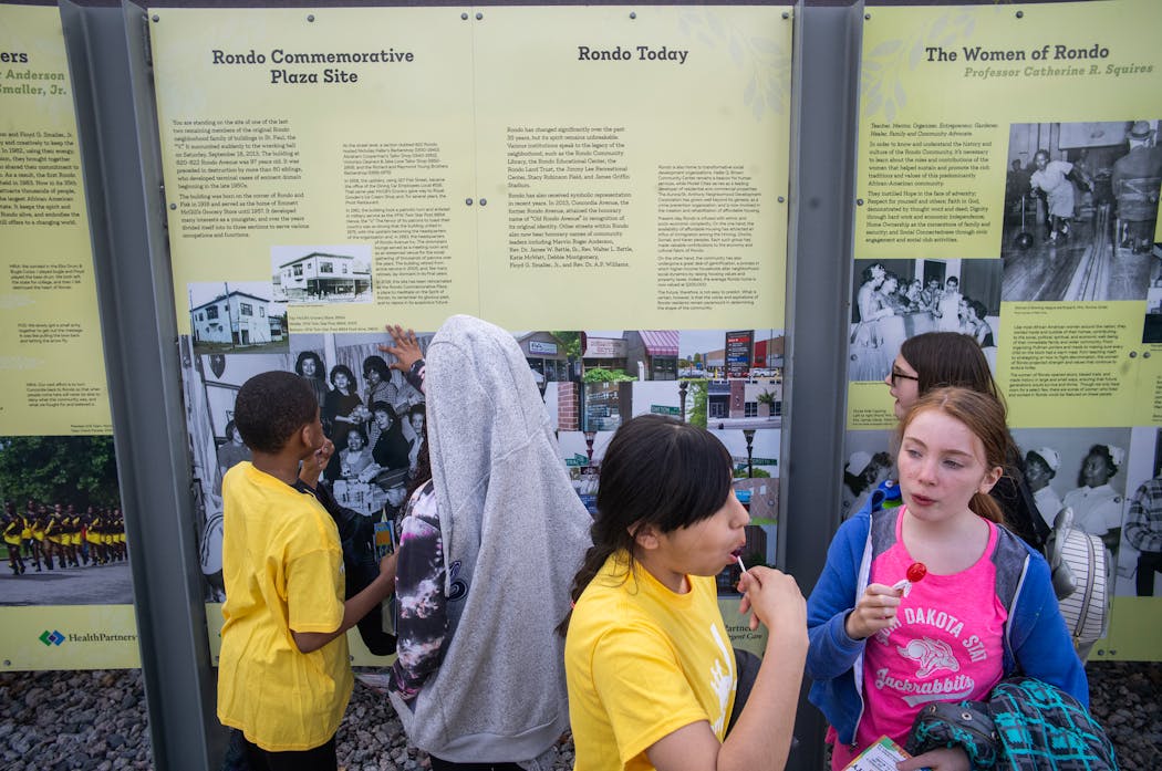 Children check out the Rondo Center of Diverse Expression detailing the history of the Rondo Neighborhood in St. Paul on Tuesday.