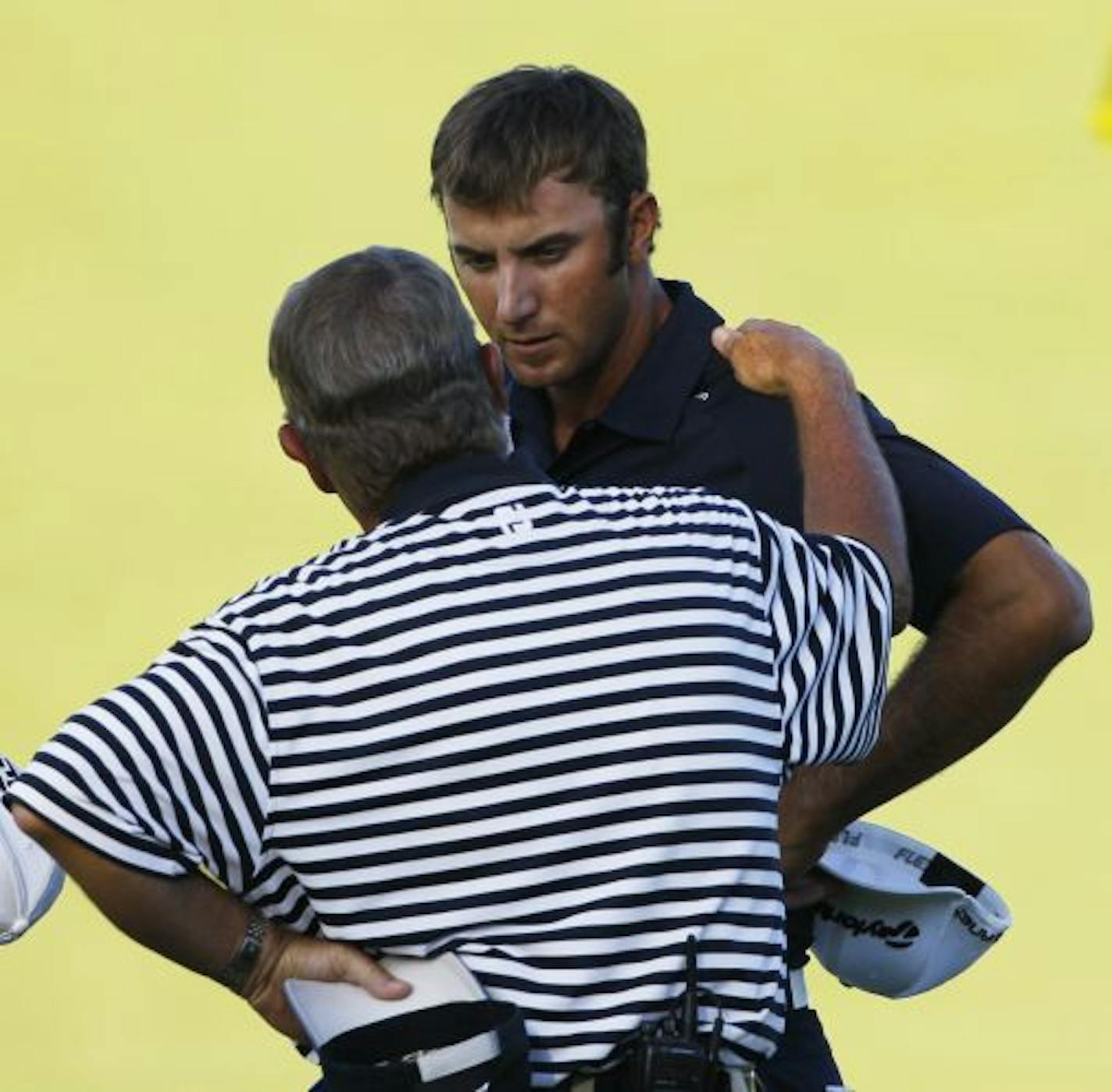 Dustin Johnson got ominous news from rules official David Price on the 18th hole of the PGA Championship on Sunday. By grounding his club in what he didn't realize was a bunker on the hole, Johnson later was assessed a two-stroke penalty and dropped out of a playoff.