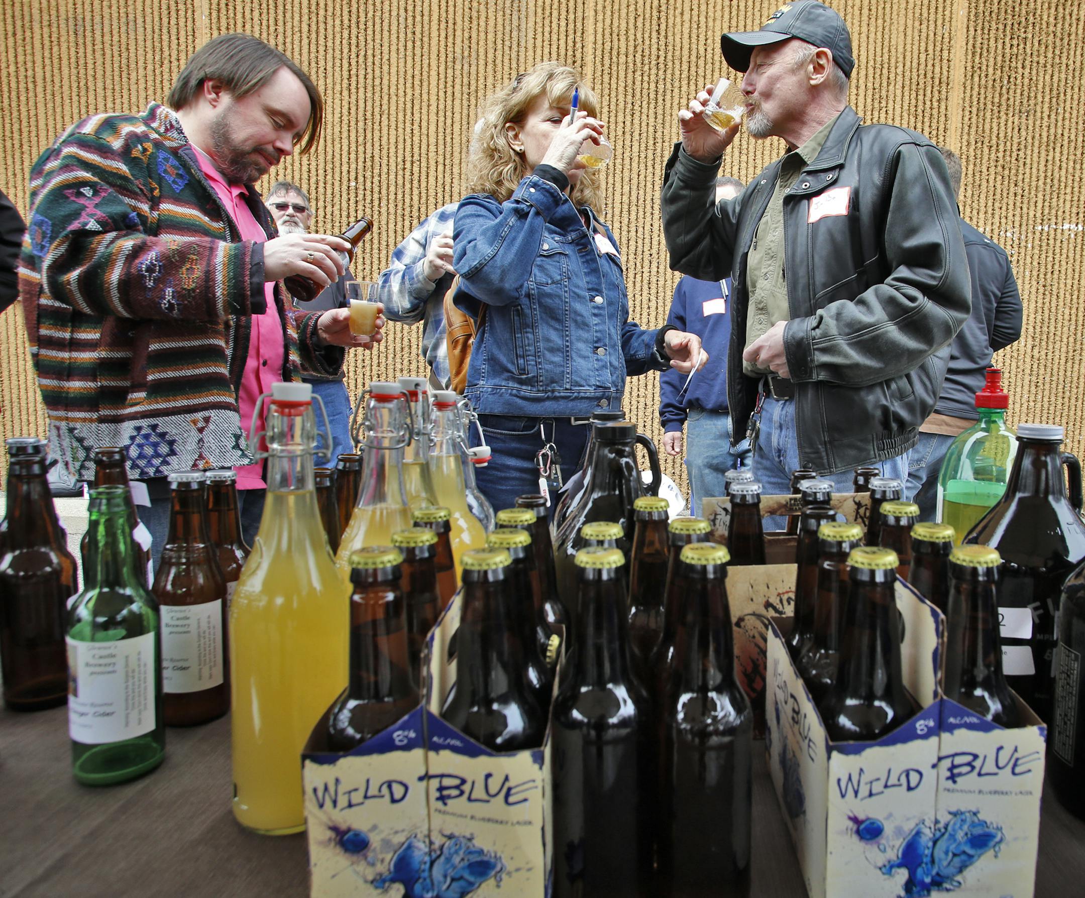 John Longballa, Terry Janecky and Jim Borchert, l-r, tasted the variety of home brews. ] Fifth annual home brew fest at Midwest Supplies in St. Louis Park. (MARLIN LEVISON/STARTRIBUNE(mlevison@startribune.com)