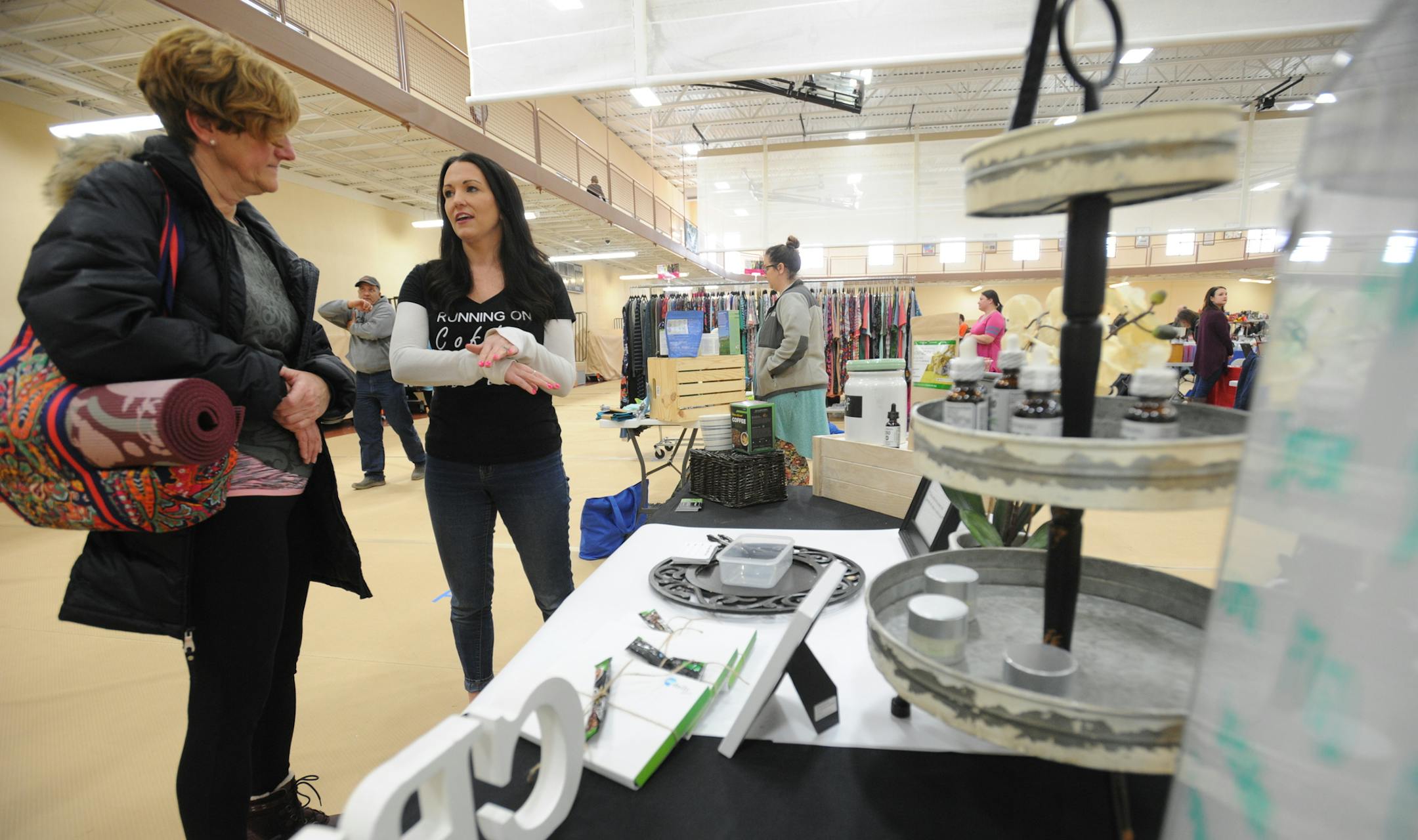 Teressa Sworsky talks with potential customers and explains the benefits of hemp oil and other CBD products at the Mokena Park District's January Flea Market on Jan. 13, 2019 in Mokena, Ill. (Warren Skalski/Chicago Tribune/TNS)