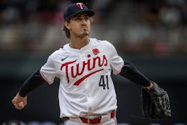 Twins starting pitcher Joe Ryan stretched on the mound Monday at Target Field.