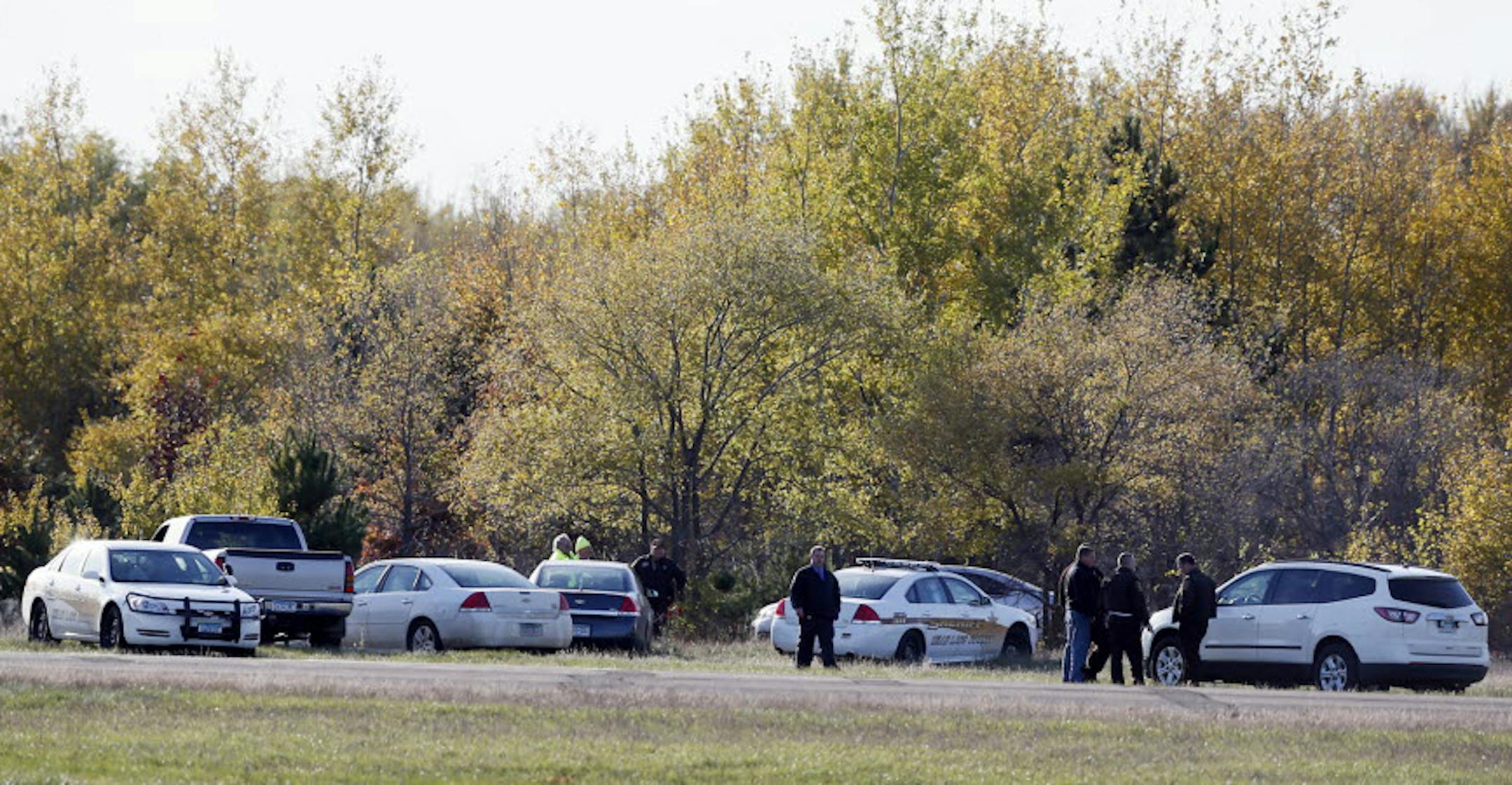Police waited near the scene were a small airplane crashed Monday, Oct. 28, 2013, in Princeton, Minn.