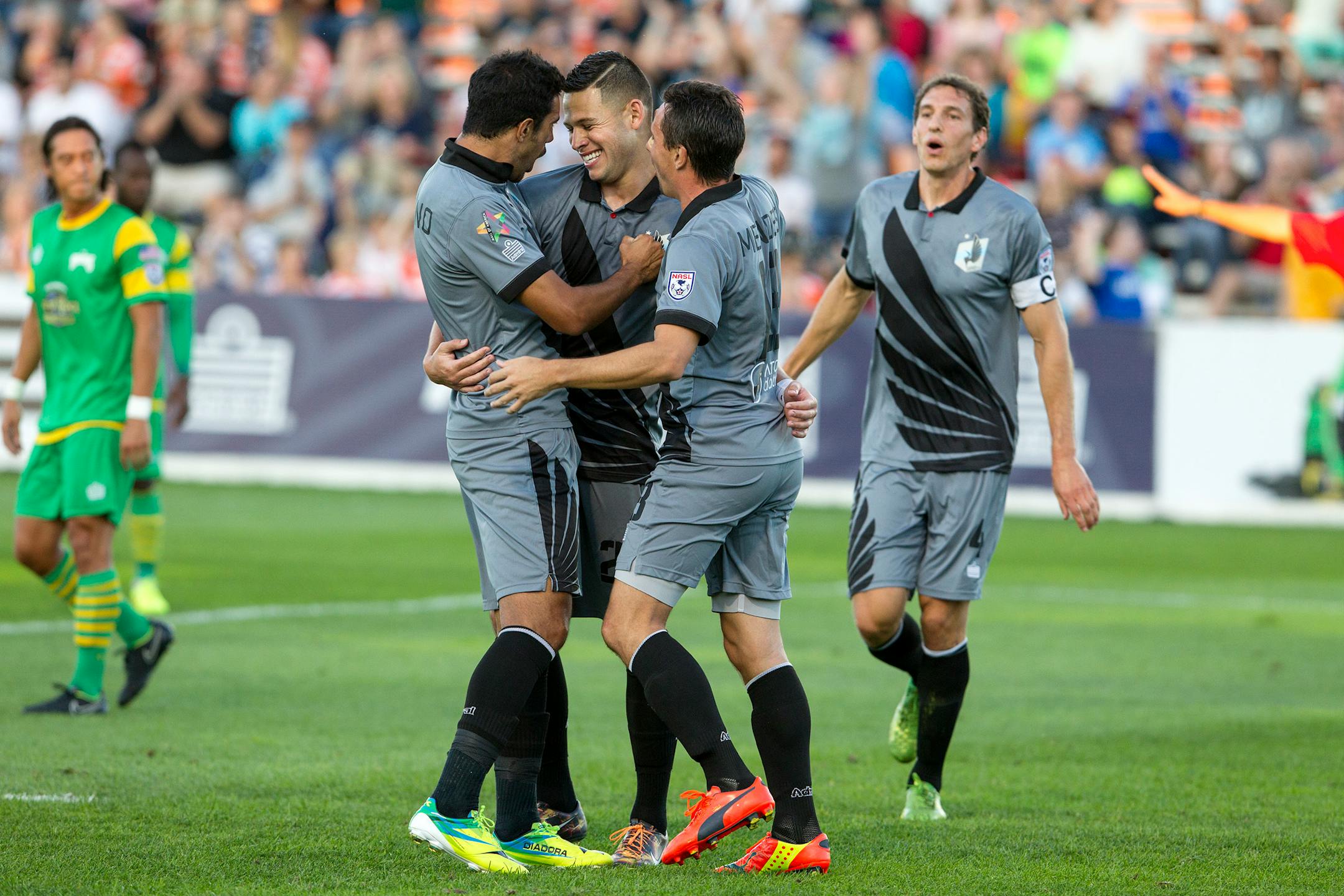 United's Christian Ramirez, center, celebrates with teammates after scoring with a penalty kick in the first half of Minnesota United FC's game against the Tampa Bay Rowdies in October.