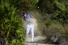 U.S. golfer Bryson DeChambeau hits from the rough of the 15th hole during the last round of the Hero World Challenge at Albany Golf Club in Nassau, Ba