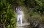 U.S. golfer Bryson DeChambeau hits from the rough of the 15th hole during the last round of the Hero World Challenge at Albany Golf Club in Nassau, Ba