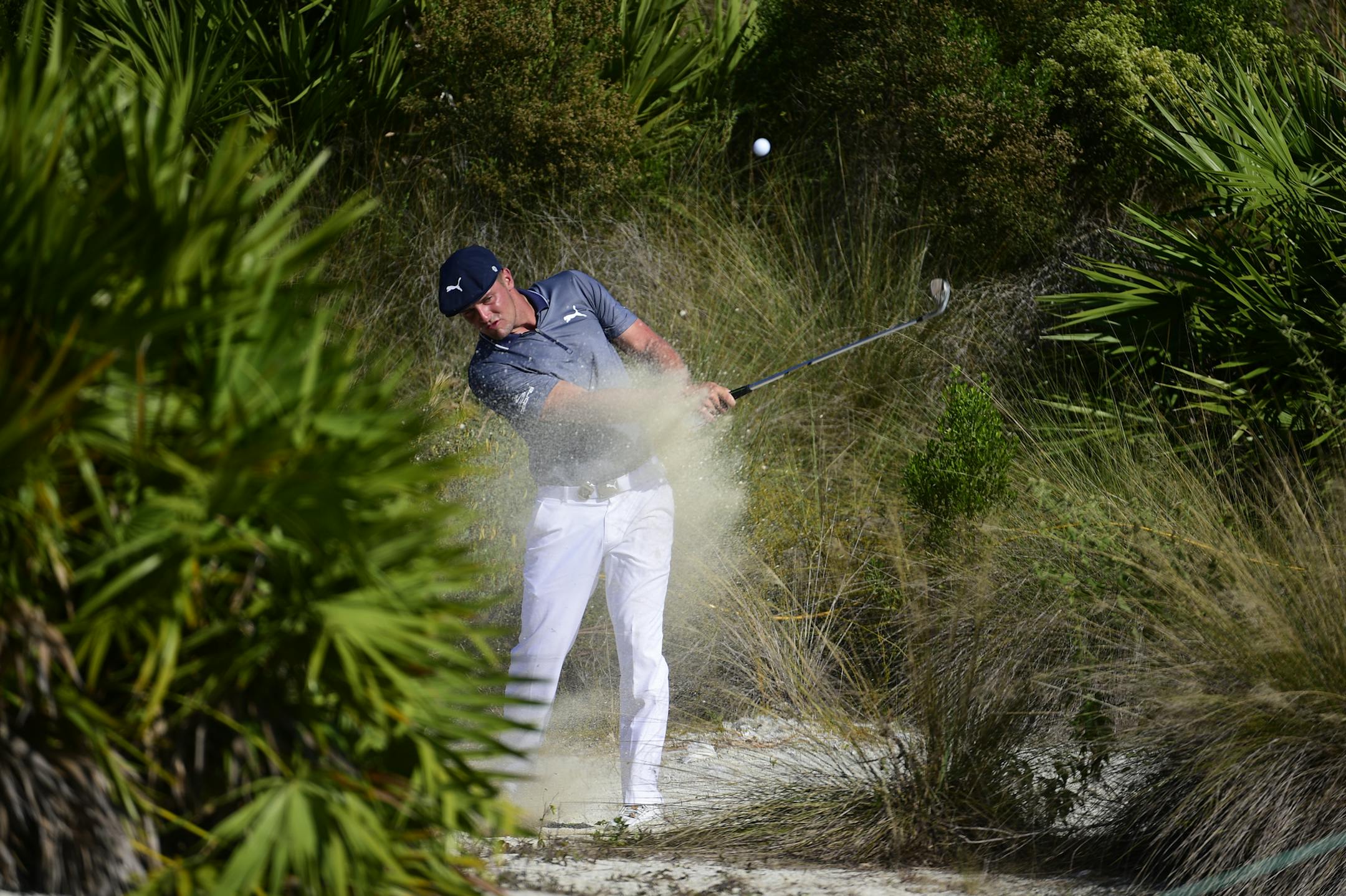 U.S. golfer Bryson DeChambeau hits from the rough of the 15th hole during the last round of the Hero World Challenge at Albany Golf Club in Nassau, Bahamas, Sunday, Dec. 2, 2018. (AP Photo/Dante Carrer)