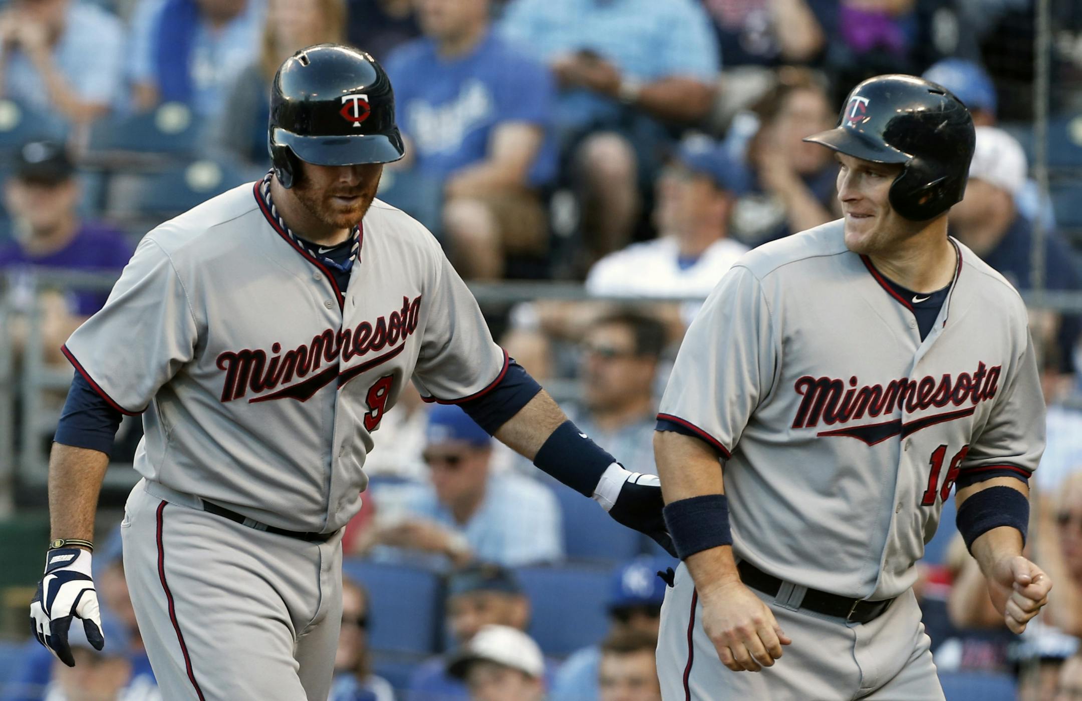 Minnesota Twins' Ryan Doumit, left, and Josh Willingham congratulate each other after Doumit's two-run home run during the first inning of a game against the Royals on Thursday, June 6, 2013.