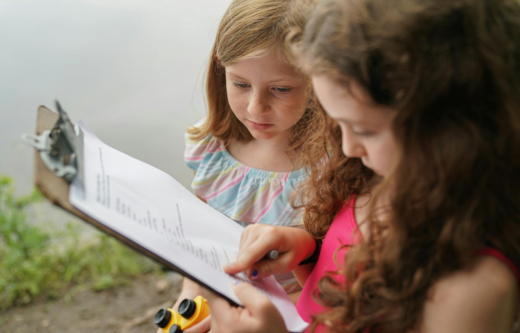 Braylynn Guentzel and Lillian Dicresce looked for Eroded Soil to check off of their nature scavenger hunt. ] GLEN STUBBE • glen.stubbe@startribune.com Wednesday, July 17, 2019 Elementary students participating in Lakeville's summer "Launch into Learning" program spent the morning doing outdoor activities at Casperson Park. The program, open to students who need extra academic help, includes both traditional classroom work and activities like these, which are designed to make summer school