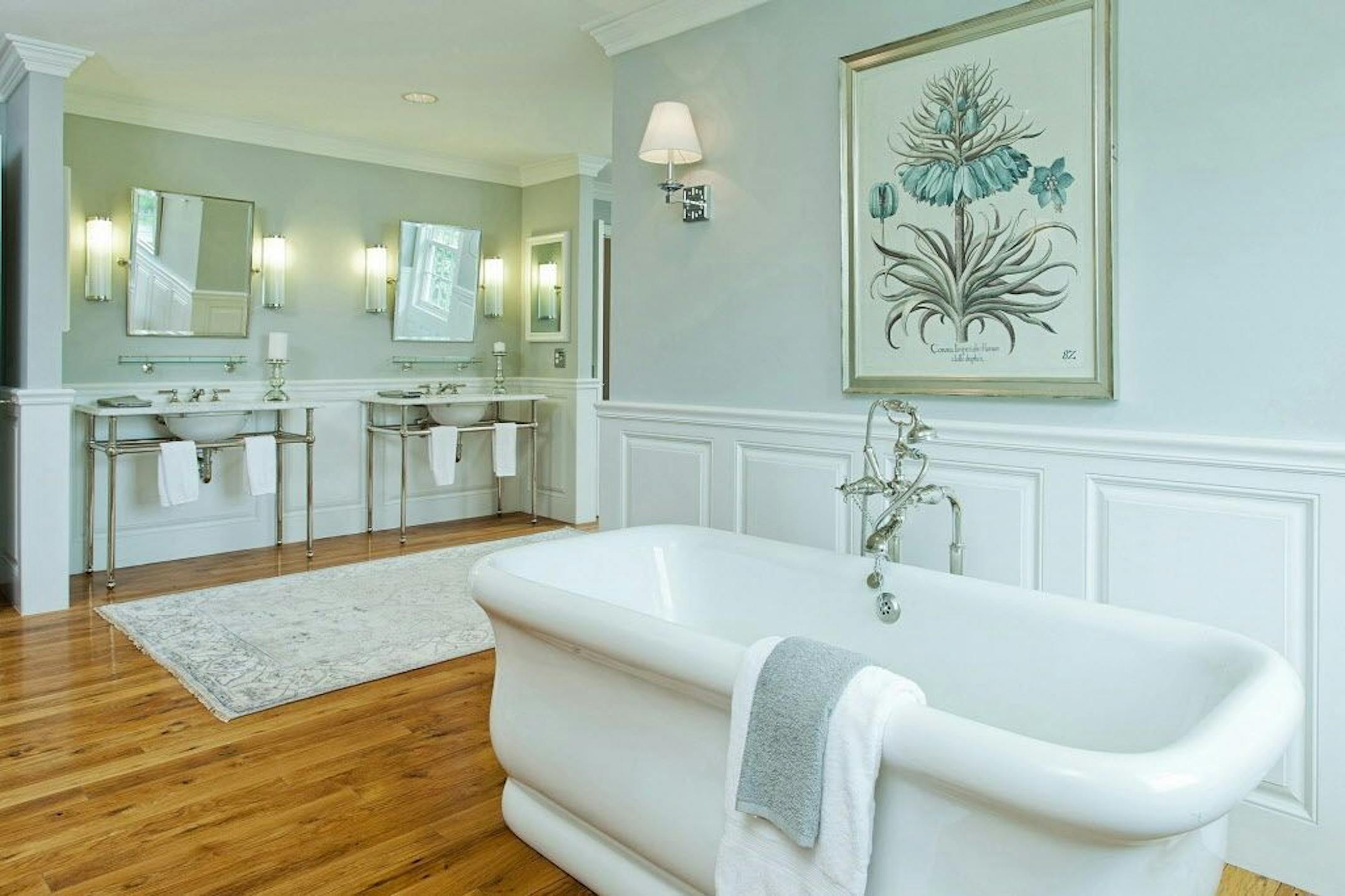 Master bathroom with double console sinks.