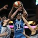 Lynx center Sylvia Fowles (34) pulled down a rebound over San Antonio forward Dearica Hamby left and Isabelle Harrison (20) on June 25