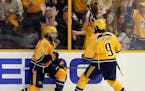 Nashville Predators right wing Craig Smith (15) celebrates his goal against the Pittsburgh Penguins with Filip Forsberg (9), of Sweden, during the thi