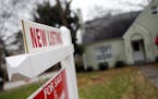 A "For Sale" sign hangs in front of an existing home in Atlanta in this 2016 photo.