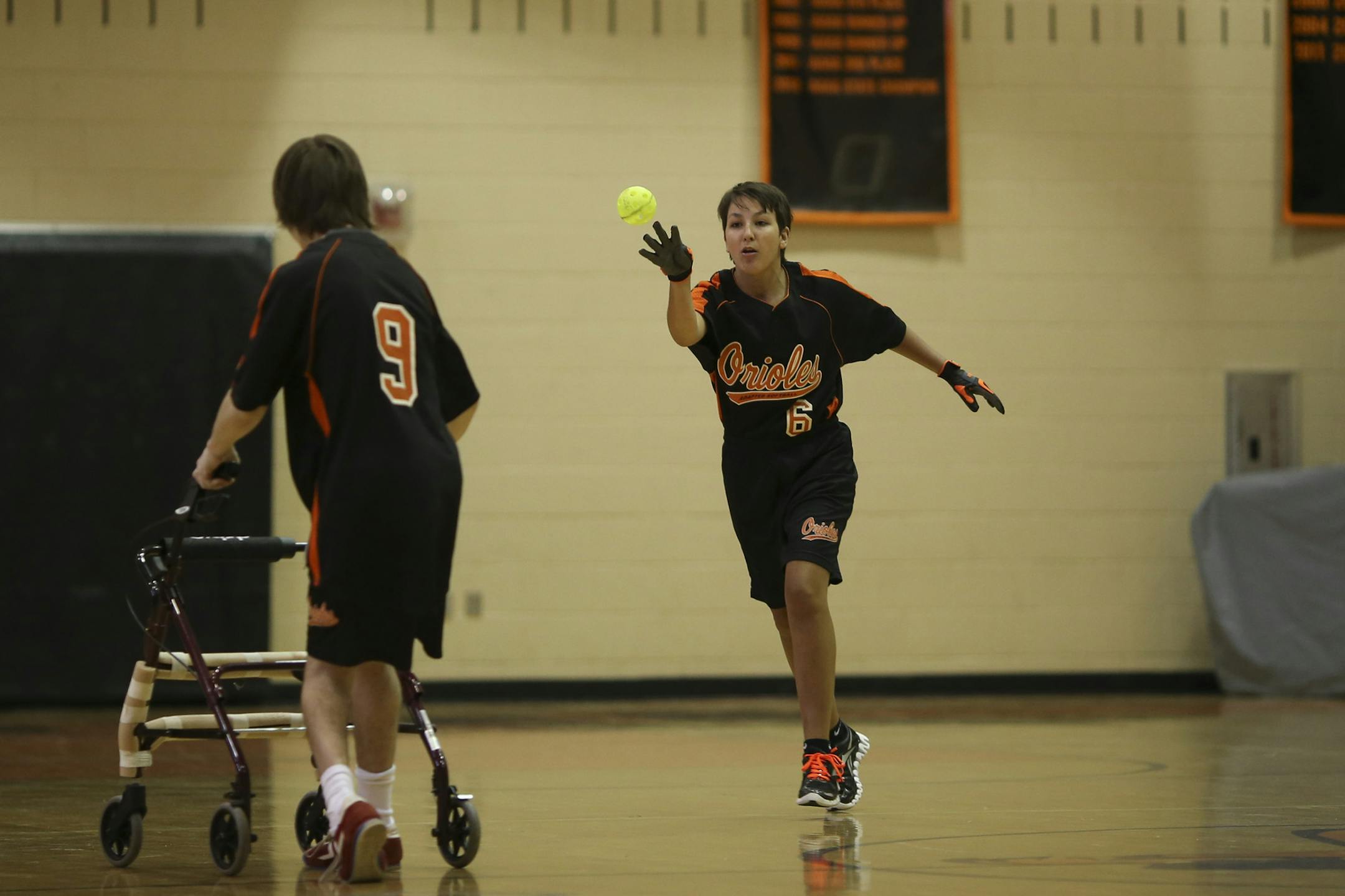 Olivia Maccoux, a Park Center junior who plays adapted softball in the physically impaired division, has worked hard to not let more than 100 surgeries over the course of her life get in the way of achieving her goals in sports or academics.