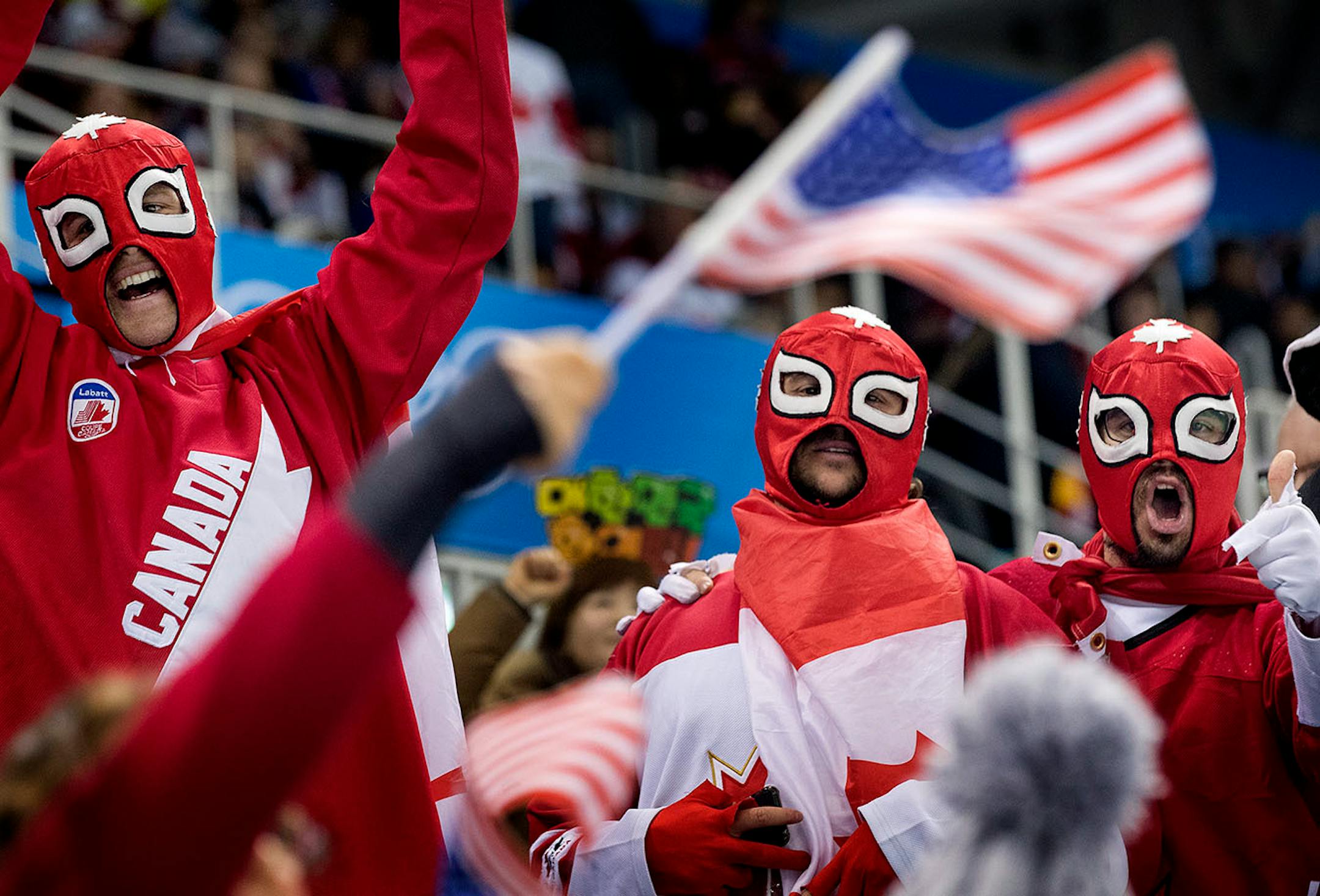 Canadian and USA fans at Gangneung Hockey Centre. USA beat Canada 3-2 in a shootout to win the gold medal.