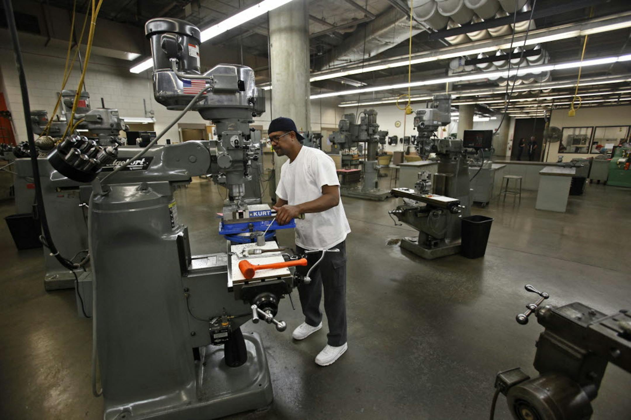 Cecil Porter, a machine tool major at MCTC, used a vertical mill machine to make a dovetail cut out of a piece of steel during machine tool tech Tuesday.