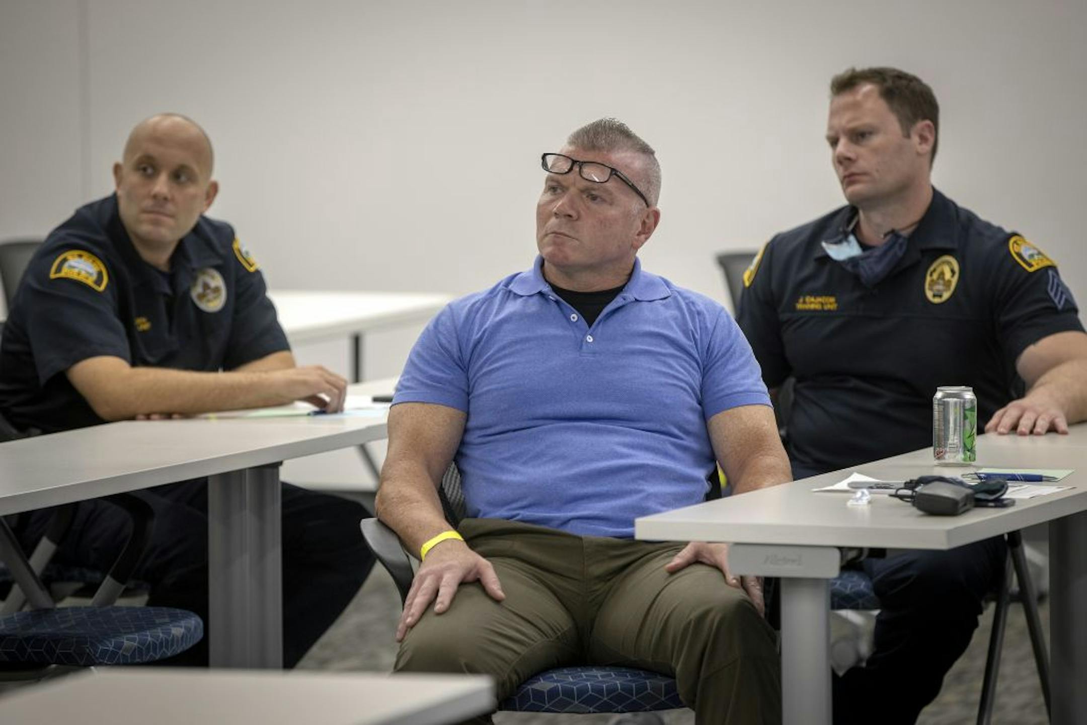 St. Paul Police Officer Seth Snedden, left, Officer Lou Ferraro, center, and Sgt. John Cajacob, right, listened to instructor Chad Weinstein during a session of Moral Courage for sworn St. Paul police officers at the Rowan Training Center, Tuesday, September 15, 2020 in St. Paul, MN.