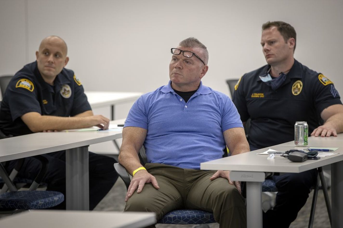 St. Paul Police Officer Seth Snedden, left, Officer Lou Ferraro, center, and Sgt. John Cajacob, right, listened to instructor Chad Weinstein during a session of Moral Courage for sworn St. Paul police officers at the Rowan Training Center, Tuesday, September 15, 2020 in St. Paul, MN.