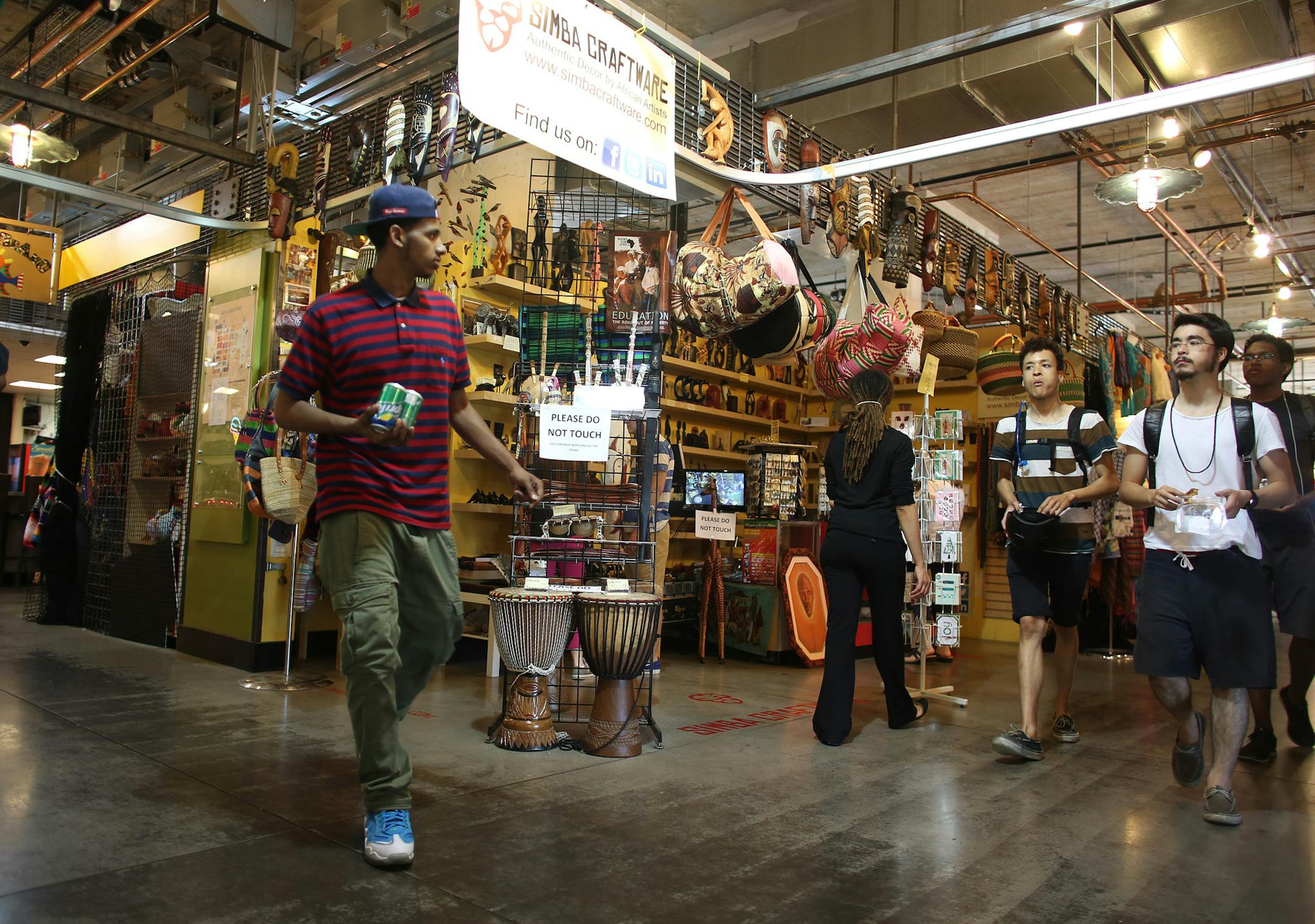 Patrons walked around the Midtown Global Market. ] (KYNDELL HARKNESS/STAR TRIBUNE) kyndell.harkness@startribune.com At the Midtown Global Market in Minneapolis , Min. Tuesday, June 10, 2014.
