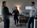 Real estate agent William Huffman of Remax Results, left, walked through the pending home sale of Kayla and Matt Dutton of Ostego Friday, Oct. 12, 201