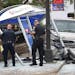 Police look over the scene where a van slammed into a crowded bus stop shelter in north Minneapolis on July 9. George Reeves Jensen of Champlin, who c